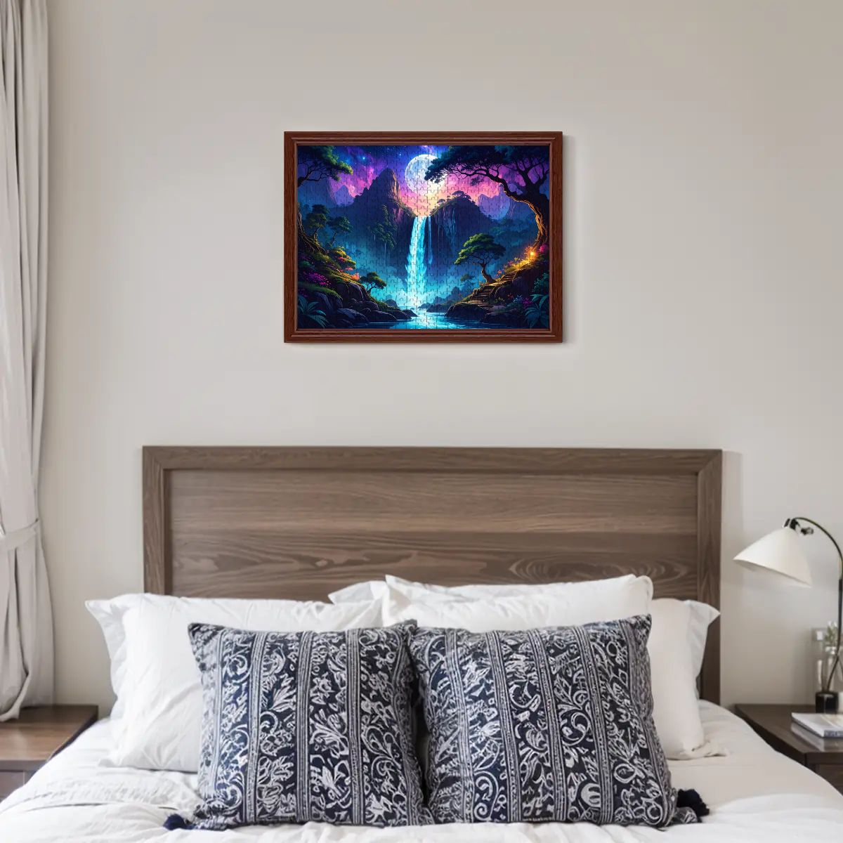 Framed artwork of a fantasy landscape with a waterfall above a bed in a bedroom.